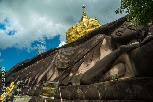 Gold Stone Sculpture,Golden pagoda ,Carved stone, at Wat Tham Pha Daen.Sakon Nakhon ,Thailand photo