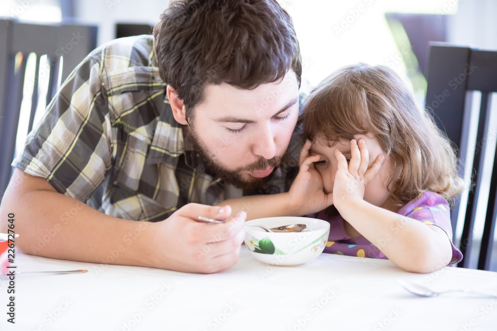 Cute little girl doesn’t want to eat. Kid refusing food. Sad child. Cute little girl doesn’t want to eat. Kid refusing food. Sad child.