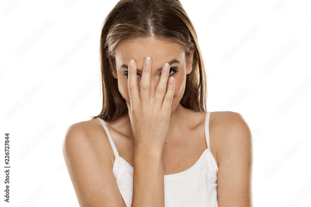 Portrait of young beautiful ashamed happy girl on white backgeound Portrait of young beautiful ashamed happy girl on white backgeound