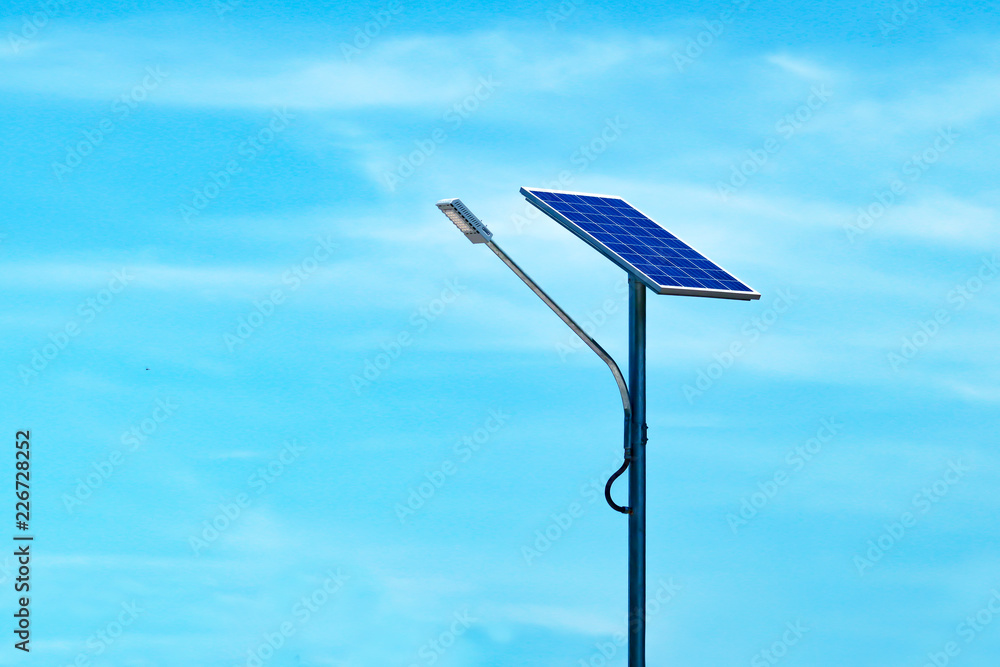 LED street light with solar cell and blue sky background. LED street light with solar cell and blue sky background.