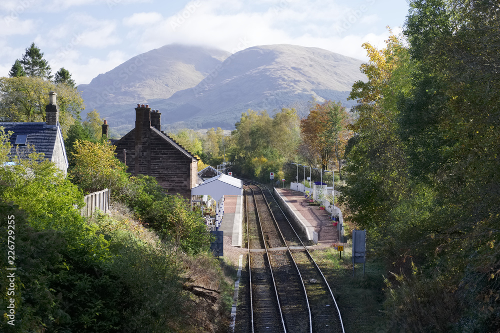 Fototapeta premium Dalmally train station in Scottish village in west Argyll view from above bridge