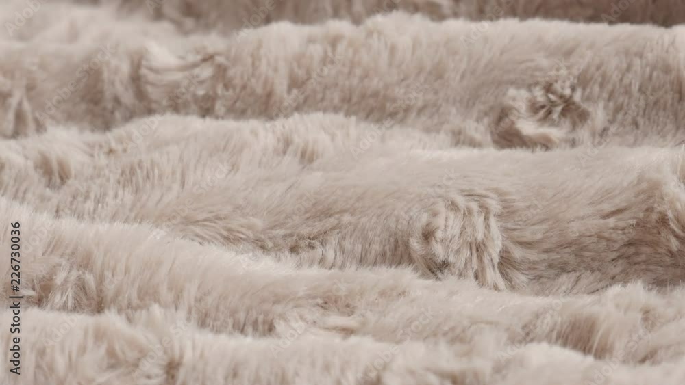 Brown blanket made of faux fur close-up slow tilt 4K video Brown blanket made of faux fur close-up slow tilt 4K video