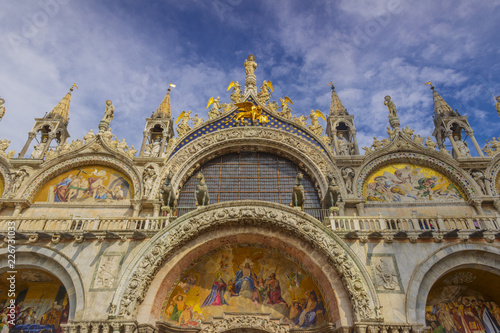 The Patriarchal Cathedral Basilica of Saint Mark at the Piazza San Marco - St Mark s Square  Venice Italy. The exterior of the west facade of Saint Mark s Basilica  Basilica di San Marco .