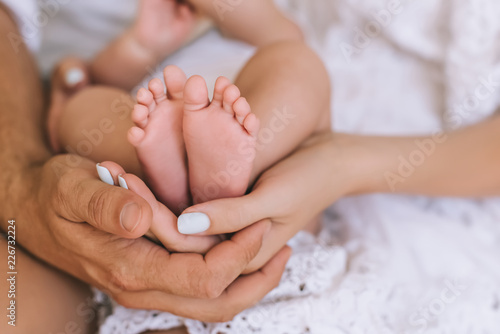 Fotografie, Obraz cropped shot of parents holding infant baby together