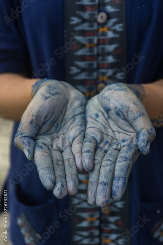 Hands made Process dye fabric indigo color in Phare Thailand. © somchaip