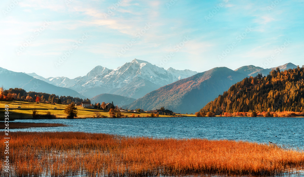 Wonderful Alpine Highlands with magic lake in Sunny Day.