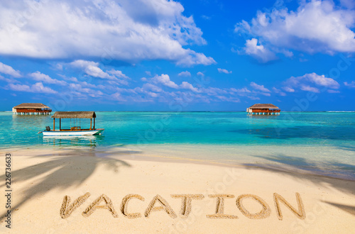Word Vacation on beach © Nikolai Sorokin