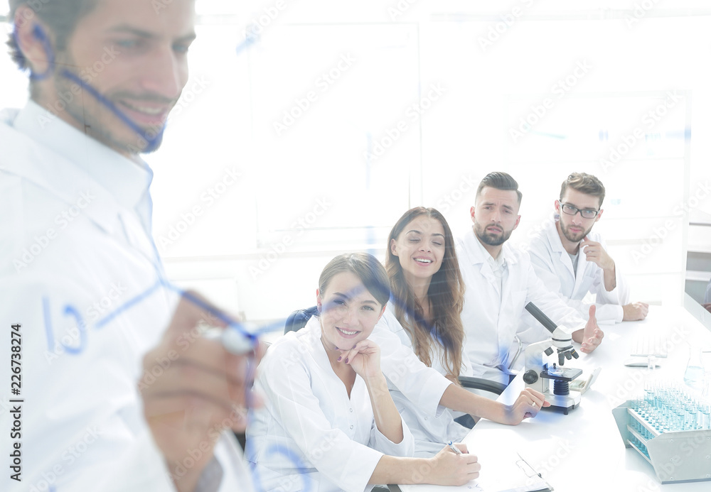 view through the transparent Board. a scientist makes a report. view through the transparent Board. a scientist makes a report.