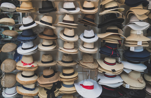 Variety of hats for sale in the market.