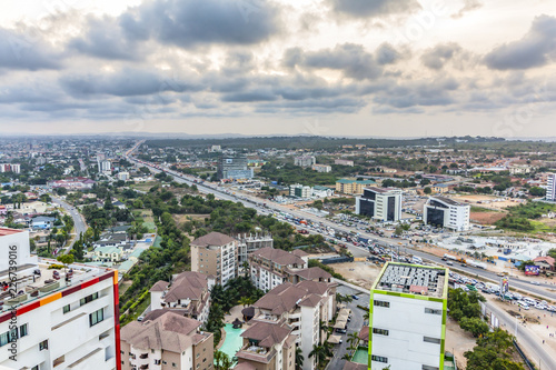 High view point cityscape of Accra, Ghana. Traffic jam on George Bush Highway with hills on the background