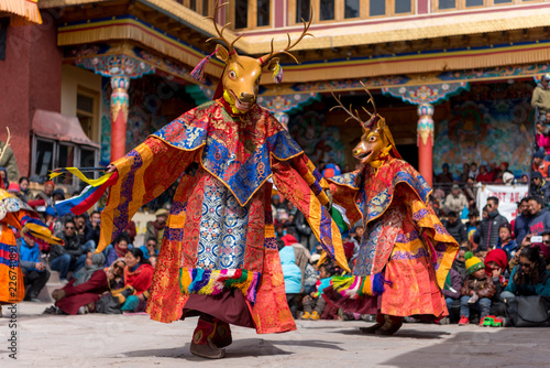 Monks wearing masks dancing at colorful buddhism mask dance festival of Matho in Ladahk, Jammu and Kashmir, India. © mbrand85