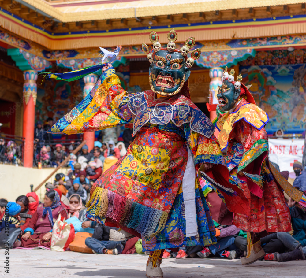 Buddhist Monk with dragon mask dancing at colorful buddhism mask dance festival of Matho in Ladahk, Jammu and Kashmir, India.