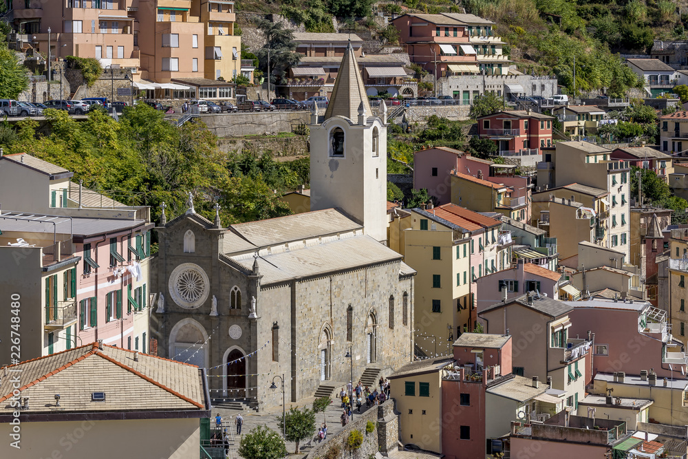 The beautiful Church of San Giovanni Battista seen from the Castle, Riomaggiore, Cinque Terre, Liguria, Italy