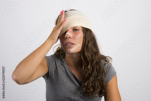 girl young woman with wounds and bandages head close up hurt and pain accident injuries concept