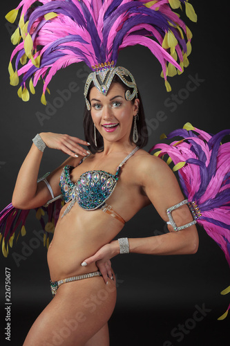 Photography Beautiful  woman in carnival costume with rhinestones and natural feathers