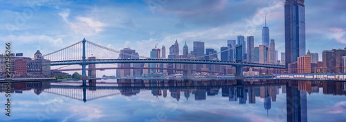 Bridge panorama  reflections over Hudson river ,New York City Manhattan midtown skyline at dusk USA