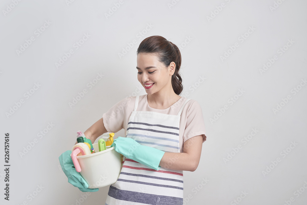 Young smiling cleaner woman. Isolated over white background. Young smiling cleaner woman. Isolated over white background.