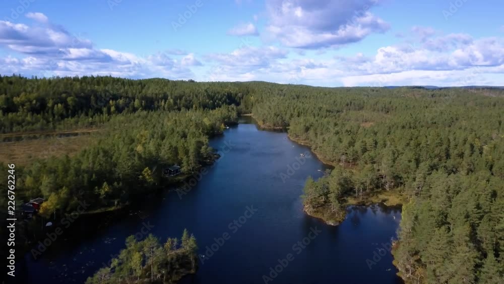 Aerial view of lake at sunset. Norwey landscape flying over lake and forest Aerial view of lake at sunset. Norwey landscape flying over lake and forest