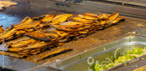 Street kitchen in Istanbul with grilled mackerel fillets. photo