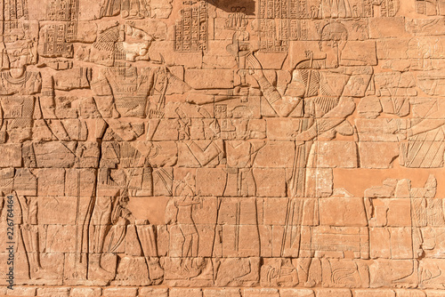 Nubian egyptian gods. Egyptian inscriptions and mural drawing, ancient Nubian kingdom art. Sudan Naga, Meroe, Kerma, Kerima. Sahara desert in Sudan near Nile river photo