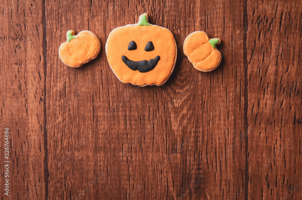 Fresh delicious homemade decorated halloween cookies sweets on dark wooden background, concept of halloween party, copy space(text space), top view, blank for text. Fresh delicious homemade decorated halloween cookies sweets on dark wooden background, concept of halloween party, copy space(text space), top view, blank for text.