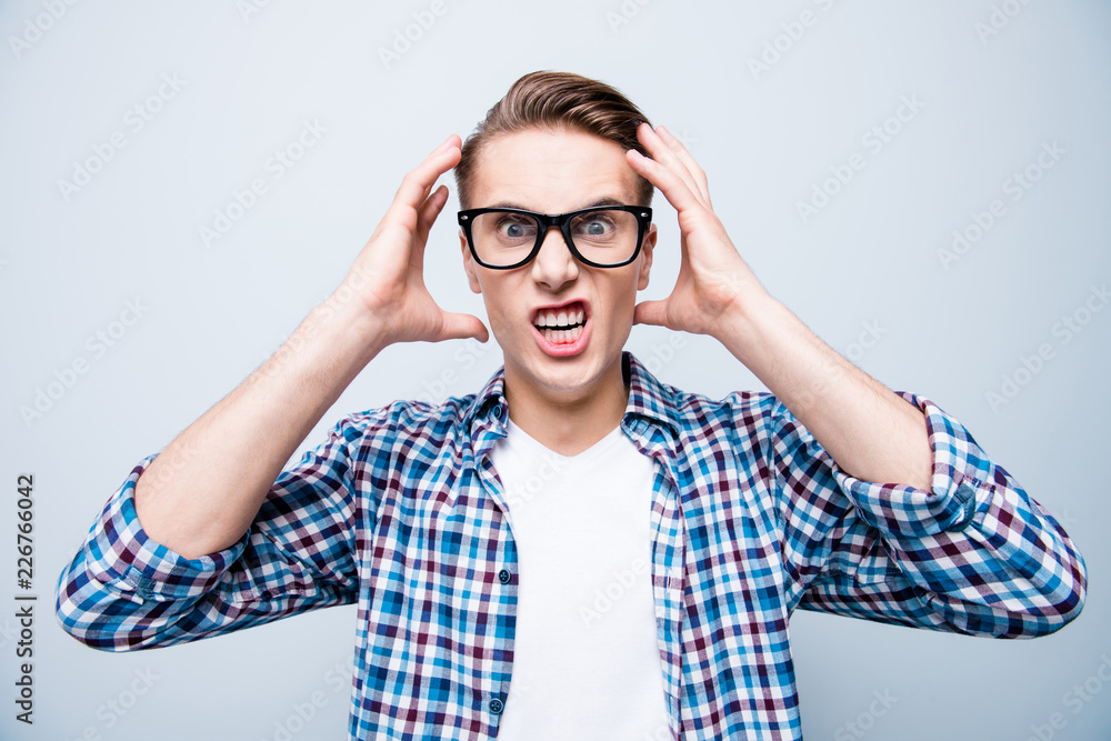 Portrait of confused mad wild crazy stylish handsome attractive Portrait of confused mad wild crazy stylish handsome attractive