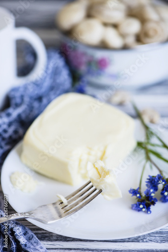 mozzarella cheese on a plate on a wooden background