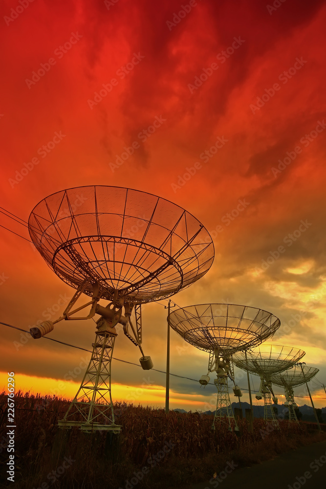 The silhouette of a radio telescope observatory The silhouette of a radio telescope observatory