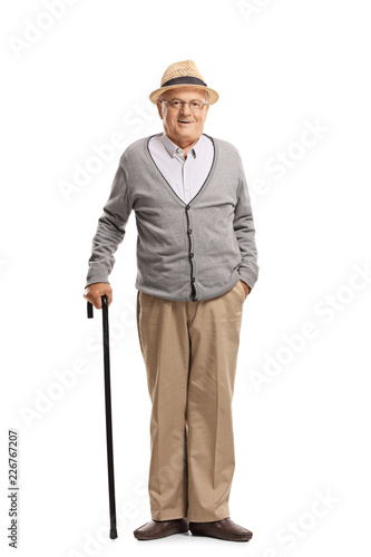 Senior man standing with a cane