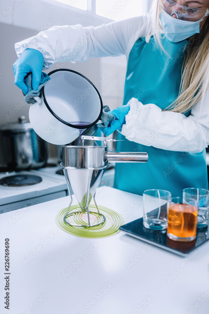 Female Candle Maker Pouring Wax Female Candle Maker Pouring Wax