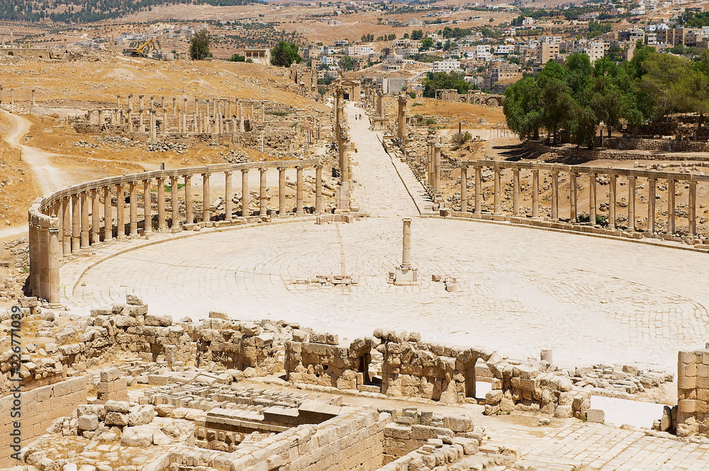 Ruins of Forum (Oval Plaza) and Colonnade street in Jerash, Jordan.