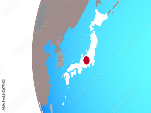 Japan with embedded national flag on blue political globe.