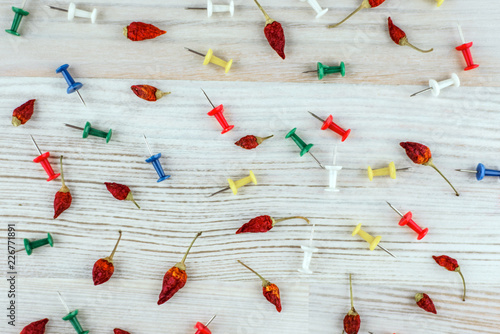 sharpness - background: Acute dried chili peppers and colorful s photo