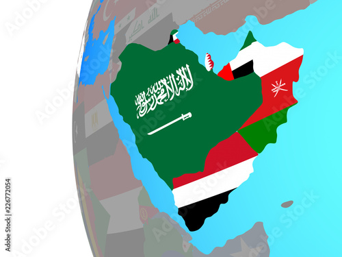 Arabia with embedded national flags on blue political globe. © harvepino