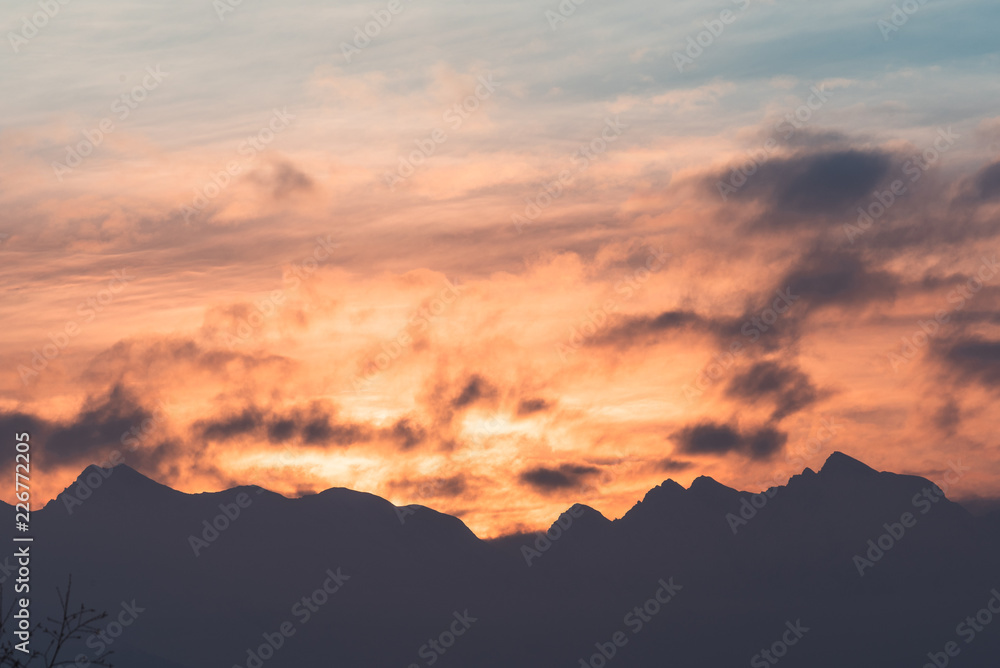 Orange sunset at mountains