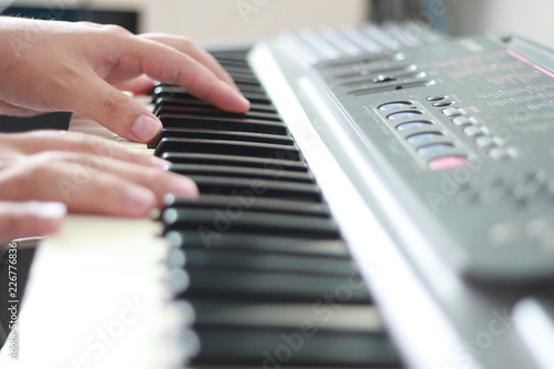 hands playing piano