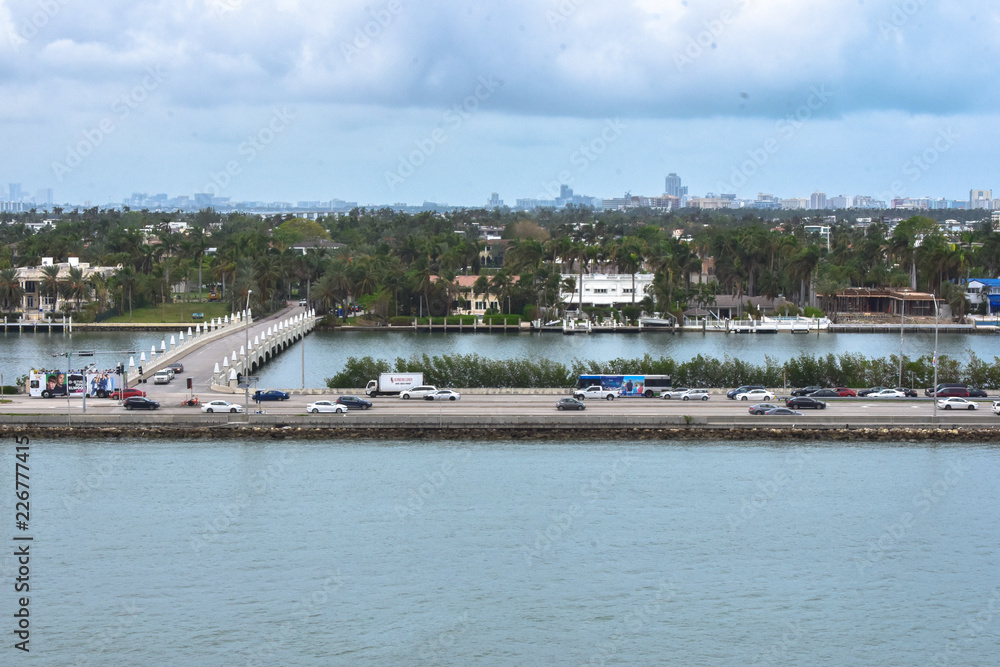 highway across the water leading towards tall city buildings in Miami, Florida