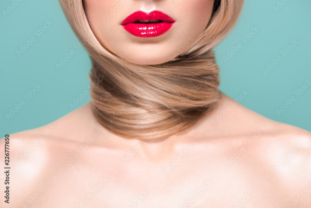 cropped shot of young naked woman with long hair around neck isolated on blue cropped shot of young naked woman with long hair around neck isolated on blue