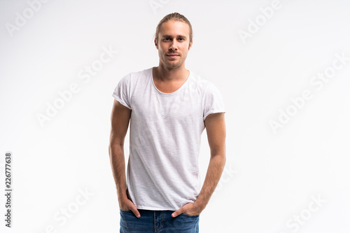 Handsome young guy posing in studio - isolated.