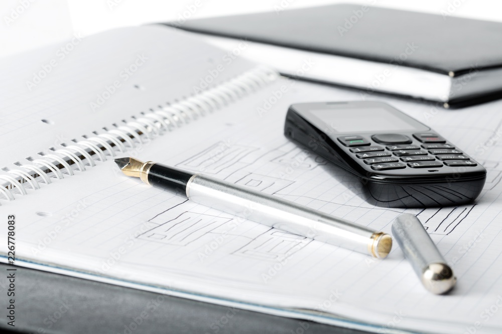 mobile phone on top of an organiser book mobile phone on top of an organiser book