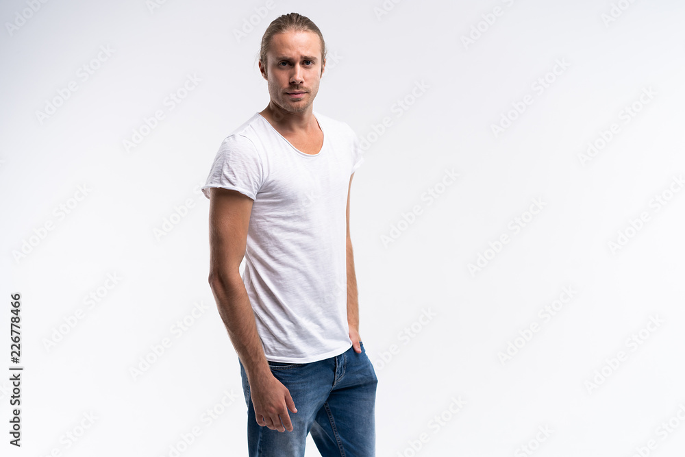 Handsome young guy posing in studio - isolated. Handsome young guy posing in studio - isolated.