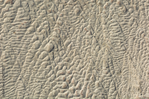 The surface of the limestone in the form of intricate patterns. The texture is made by flowing water for many years in Turkish Pamukalle. An interesting natural phenomenon.