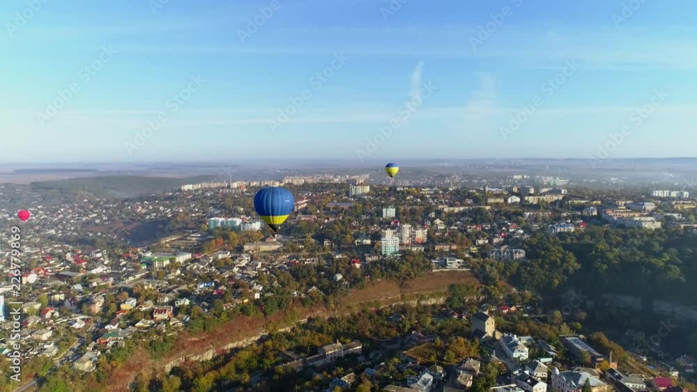 Aerial view of group of hot air balloons above the city Aerial view of group of hot air balloons above the city