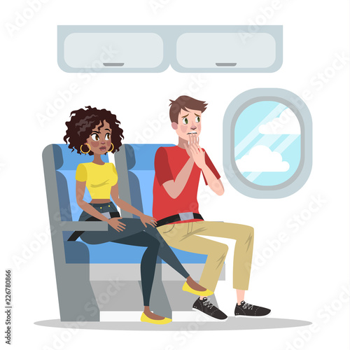Fear of height. Man in airplane is afraid