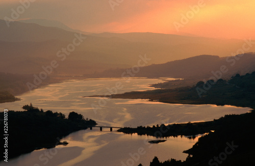 Photos A map of Scotland appears at sunset on Loch Garry