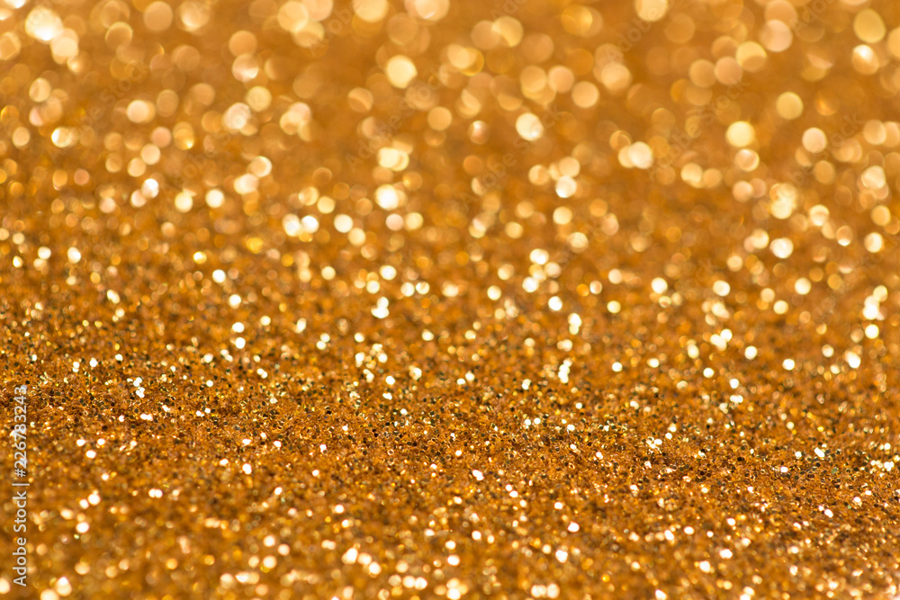golden glitter bokeh texture with place for text: christmas, celebration, party, invitation abstract background golden glitter bokeh texture with place for text: christmas, celebration, party, invitation abstract background