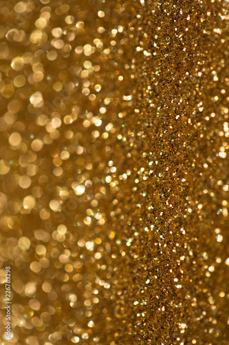 golden glitter bokeh texture with place for text: christmas, celebration, party, invitation abstract background
