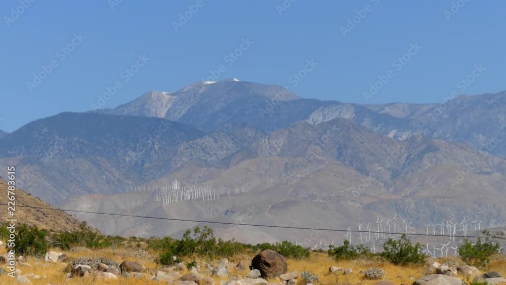 Wind turbines generating electricity at a desert wind farm near Palm Springs, California, USA Wind turbines generating electricity at a desert wind farm near Palm Springs, California, USA