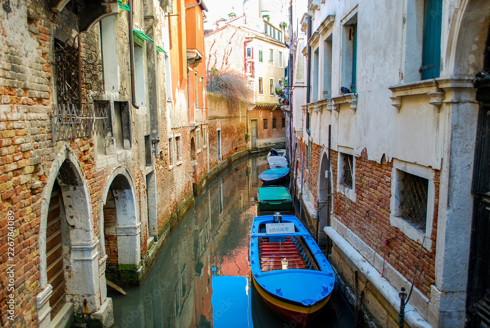 Line of boats in a Venice Neighborhood Canal