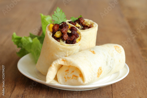 Burritos wraps with minced pork and vegetables.